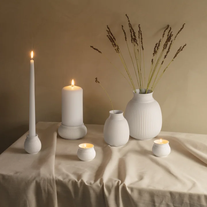 Decorative porcelain holders for lights and candles