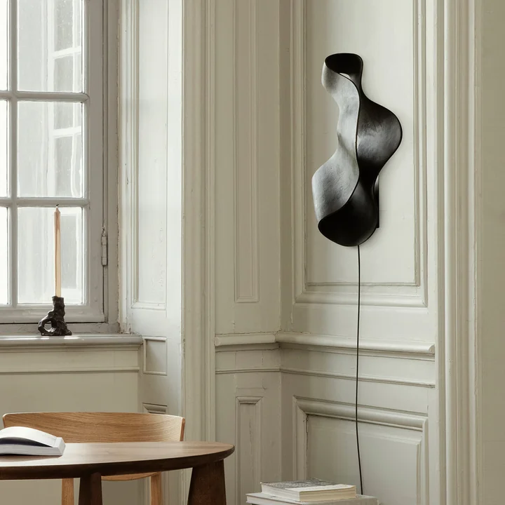 Oyster wall lamp by Ferm Living in the colour black