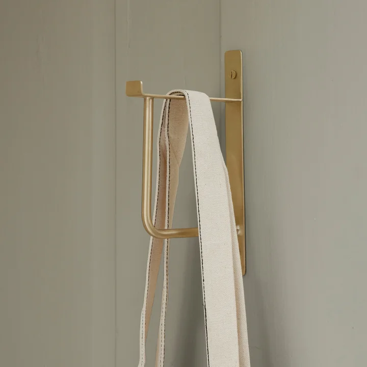 Clothes wall hook by Ferm Living in the brass finish