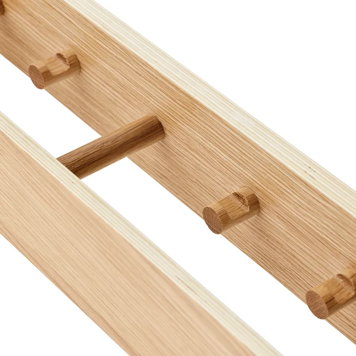 Wall coat rack with concealed hooks