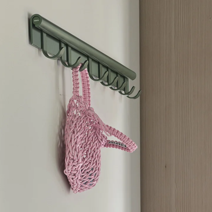 Coil Wall coat rack from Muuto in the colour dark green