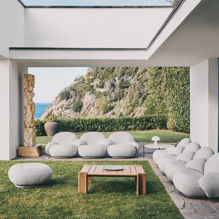 Pacha Lounge Chair and Atmosfera Outdoor side table from Gubi