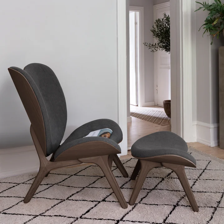 A Conversation Piece Tall armchair and ottoman by Umage