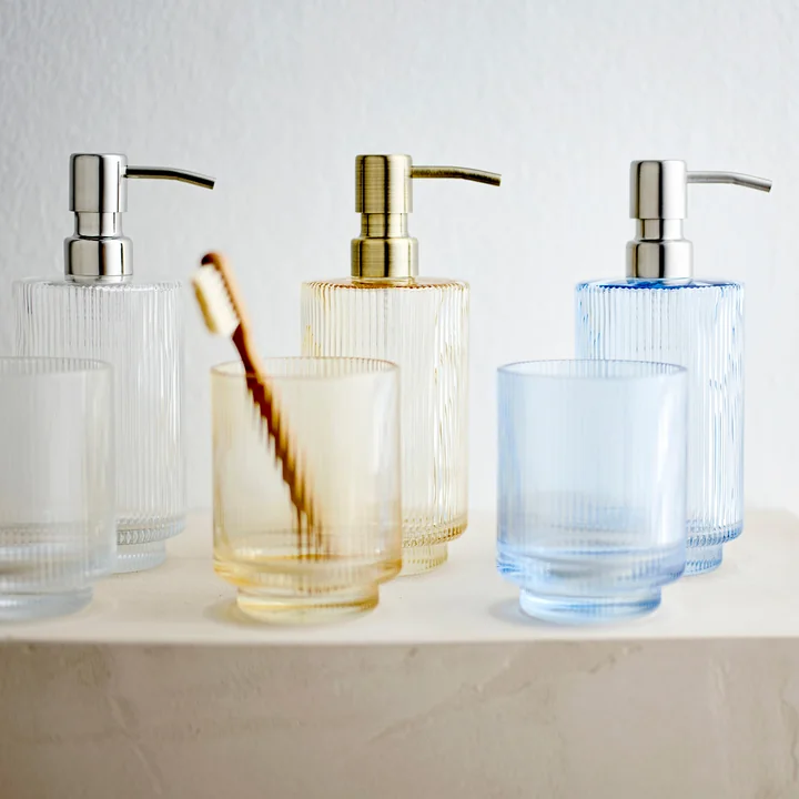 Clarity Soap dispenser and toothbrush mug from Södahl in color golden yellow