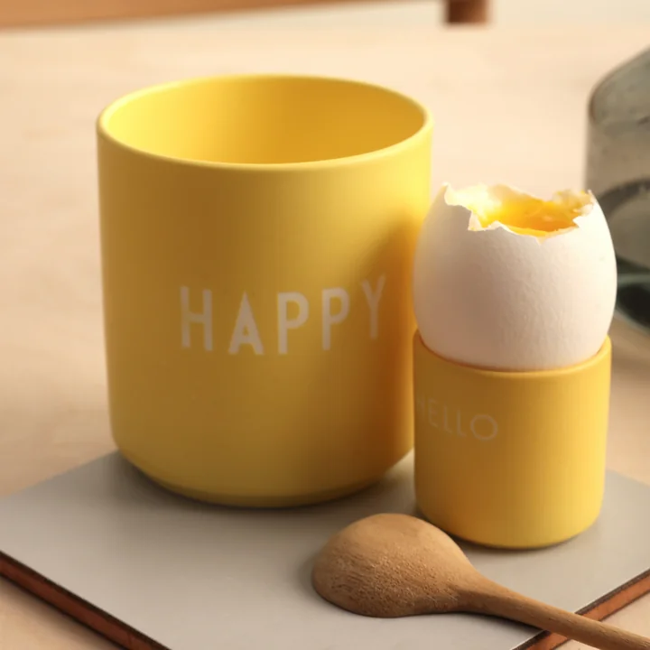 AJ Favourite Porcelain mug from Design Letters in the version Happy / yellow with egg cup