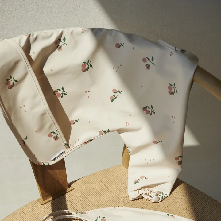 Merle Cape bib from LIEWOOD in the peach, sea shell mix version