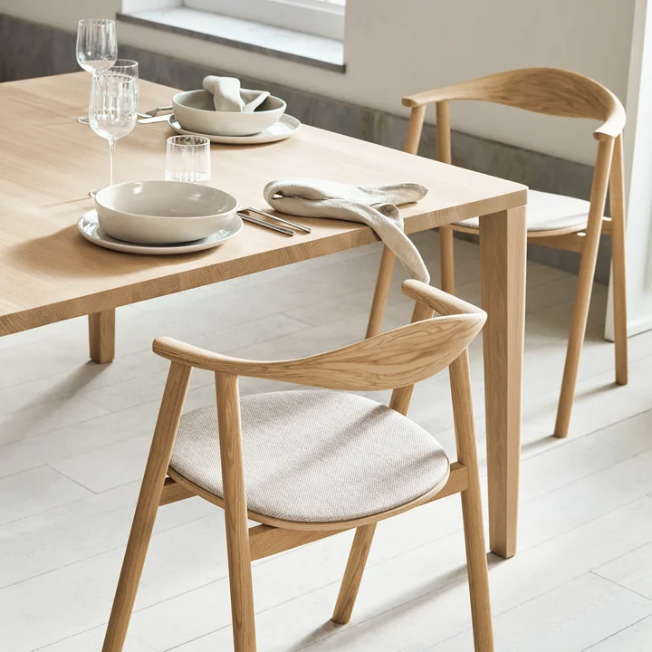 Graceful Dining table and Swing armchair from Bolia
