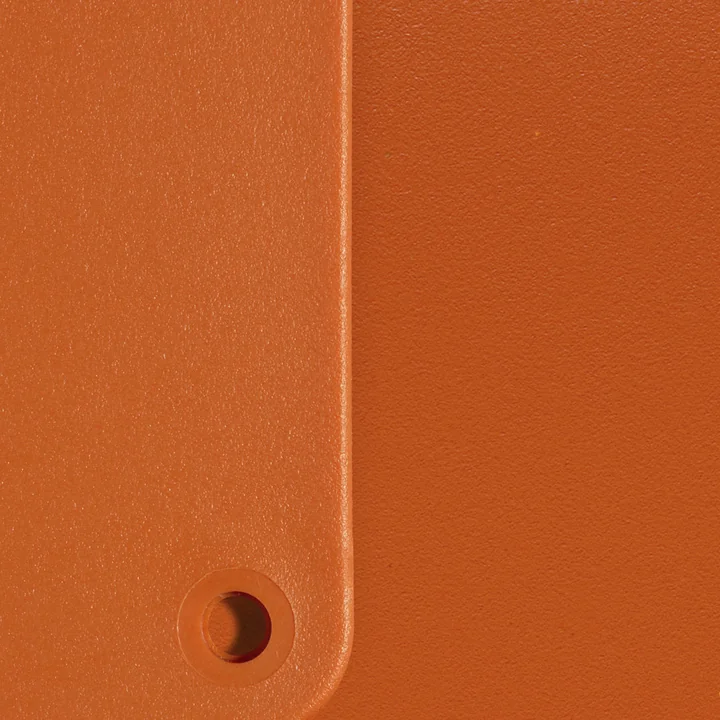 Eames Plastic RE material sample from Vitra in the color rust red