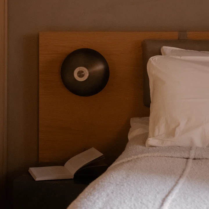 Audo - Reverse LED wall light, Ø 24 x H 15.5 cm, burnished brass / travertine stone (hard-wired)