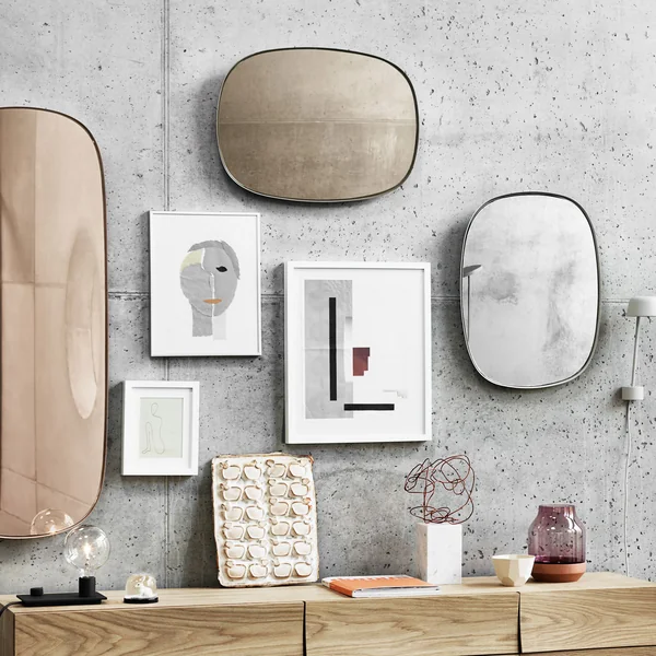 Framed mirrors on the living room wall