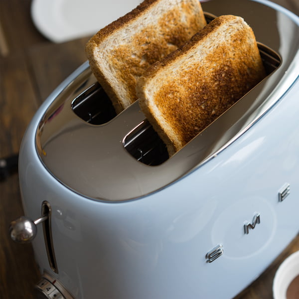 2-slices toaster TSF01 in pastel blue by Smeg with toast slices