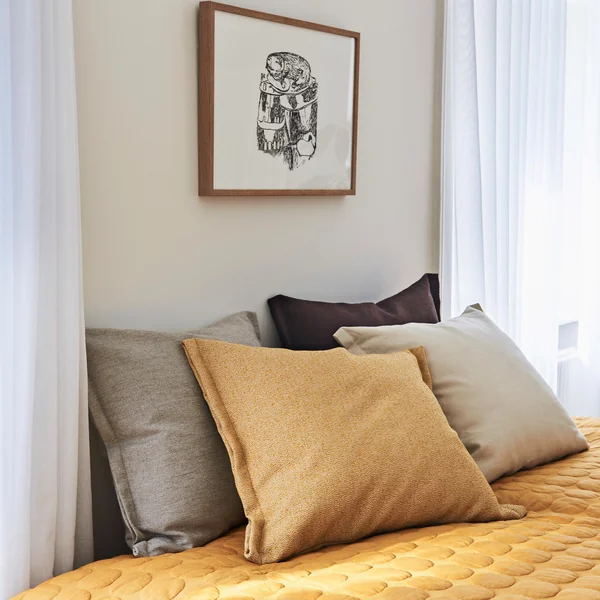 Plica Sprinkle cushion from HAY arranged on the bed