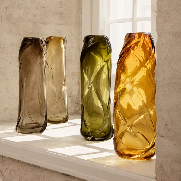 The Water Swirl vase from Ferm Living in its various colors on the windowsill