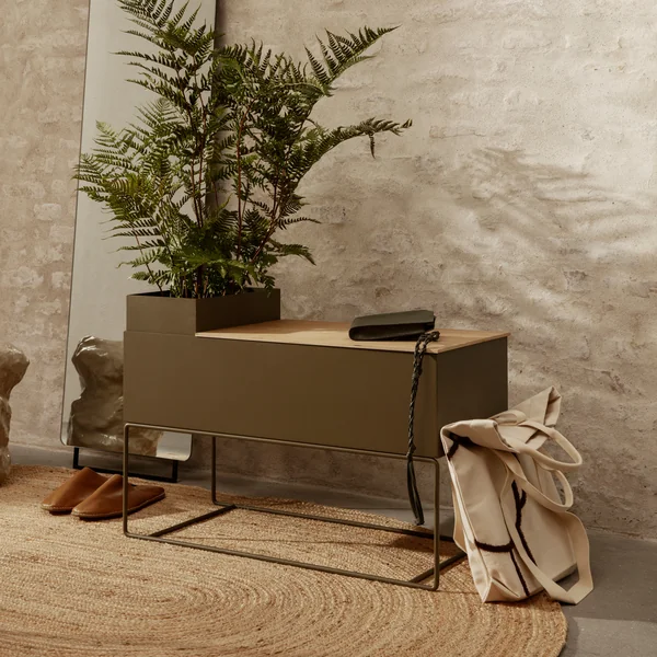 The large Plant Box from Ferm Living with an indoor palm tree and everyday objects in the hallway