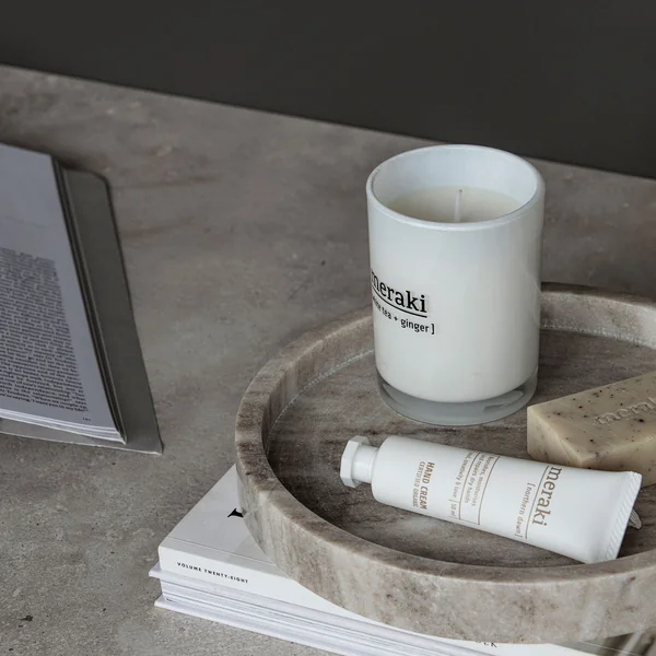 The hand cream from Meraki on a stone tray