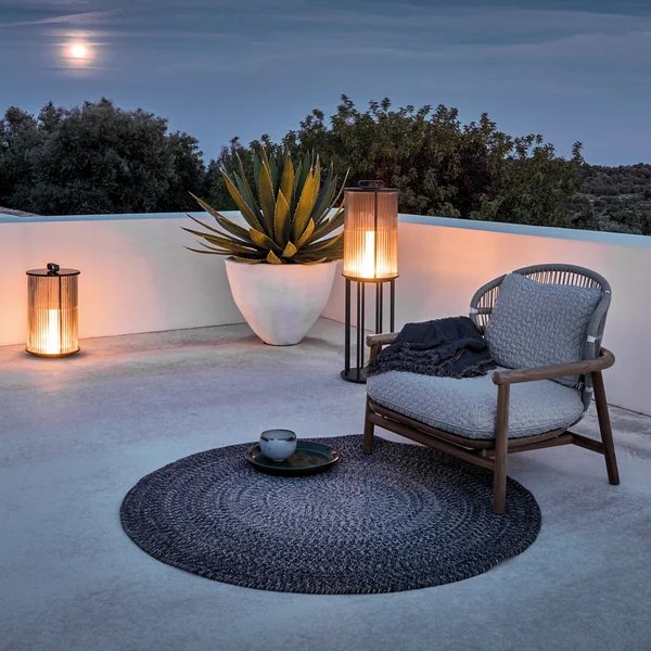 Outdoor furniture and lighting from Gloster create a romantic atmosphere