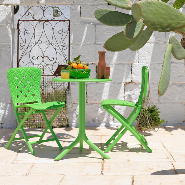 The Italian Zac Spring folding chair from Nardi on a stone terrace