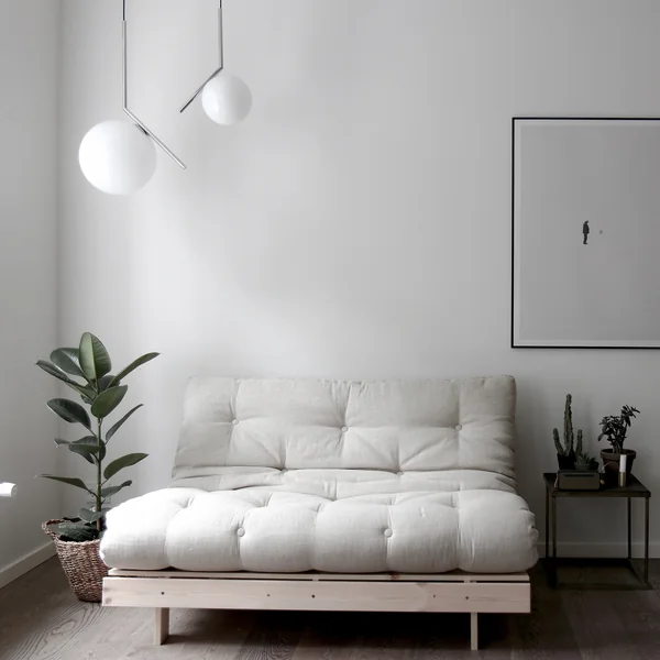 The Roots sofa bed from Karup Design in a minimalist room