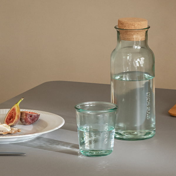 Recycled carafe with cork and recycled drinking glass by Eva Solo